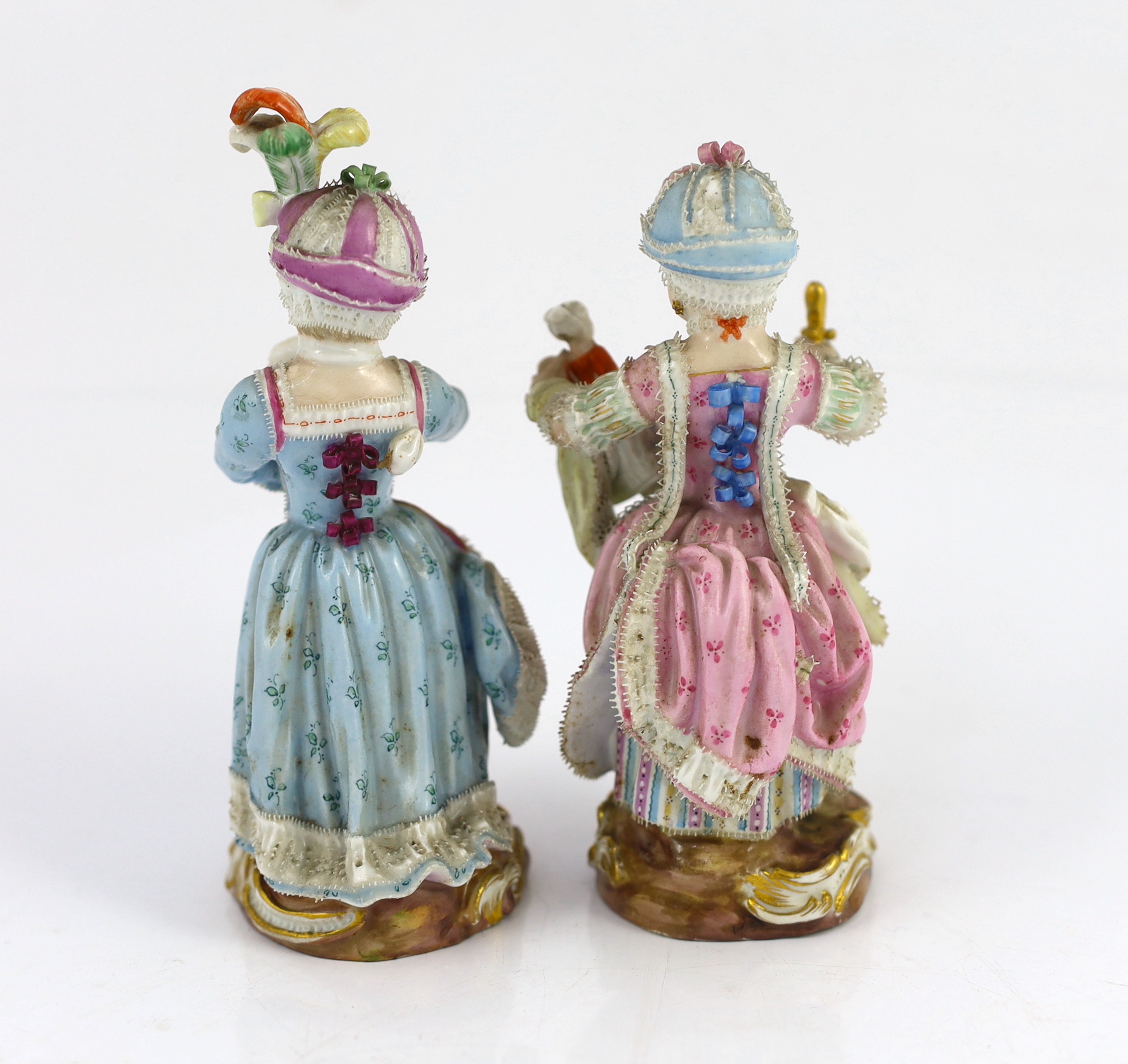 Two Meissen figures of a girl holding a doll and another with a toy sheep, 19th century, tiny losses